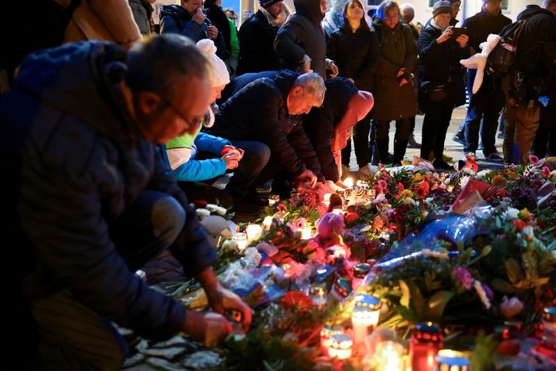 First grief, then a more political tone at site of Germany Christmas market attack By Reuters