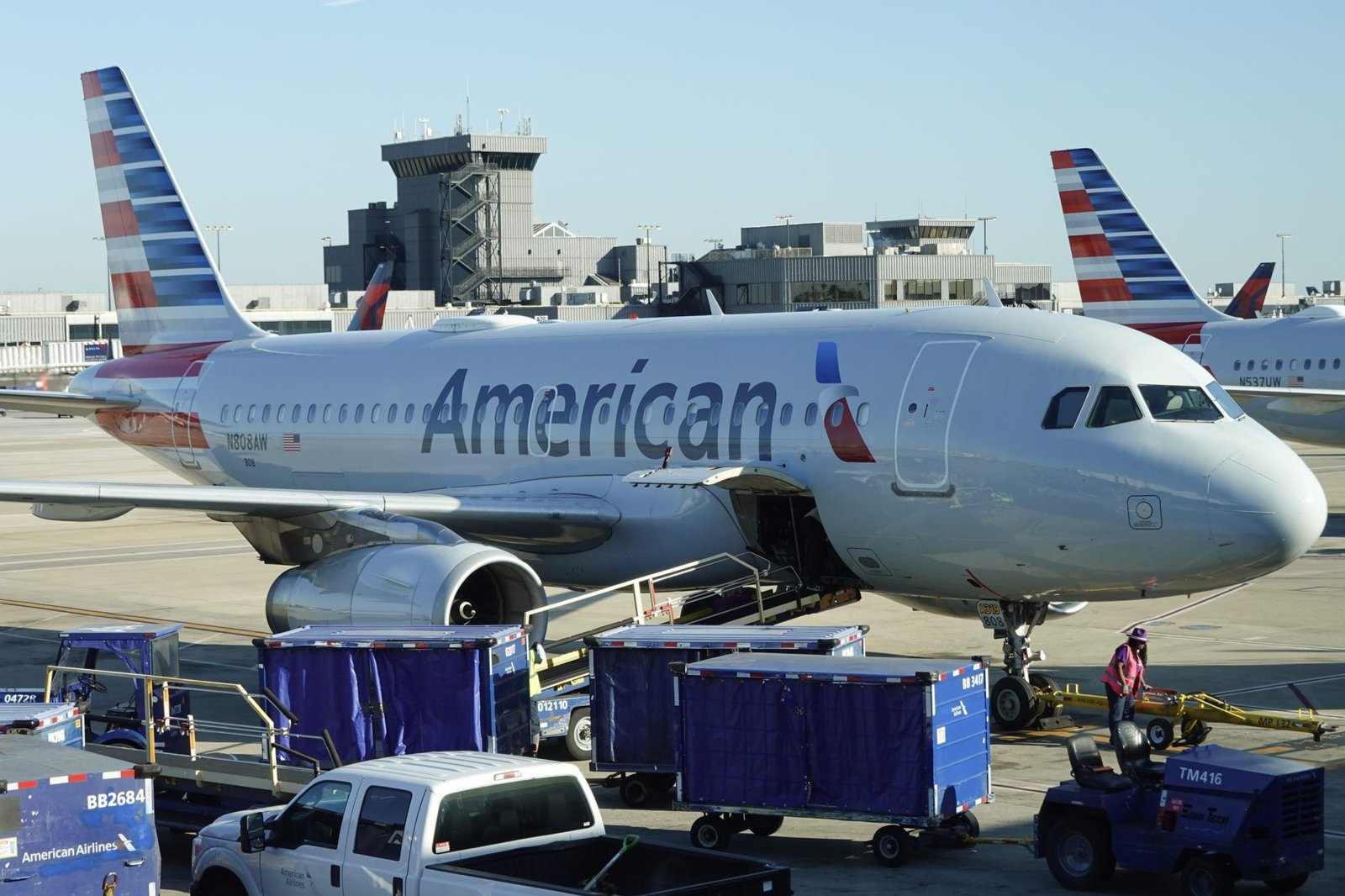 American Airlines plane catches fire at Denver airport sending 12